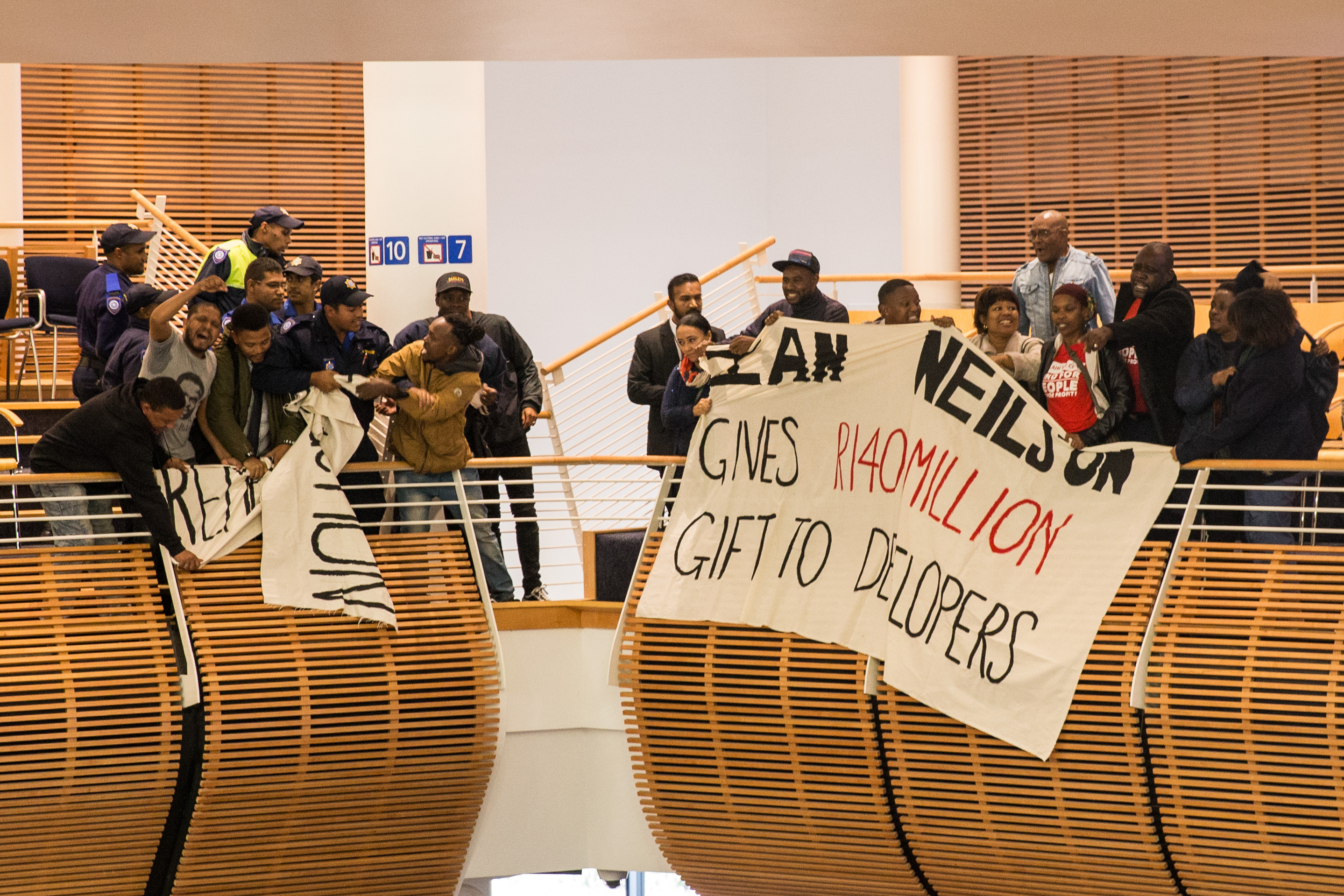 Housing activists interrupt council meeting | GroundUp Housing activists interrupt council meeting | GroundUp